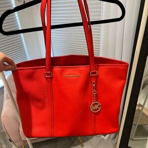 Michael Kors red tote bag